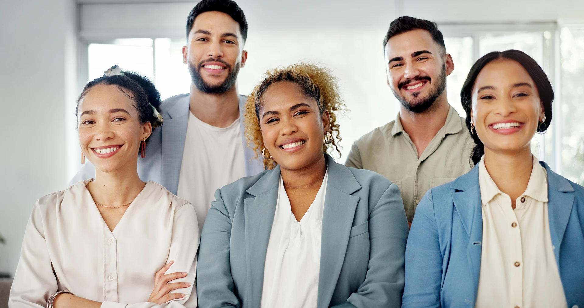 business-people-teamwork-and-arms-crossed-in-office