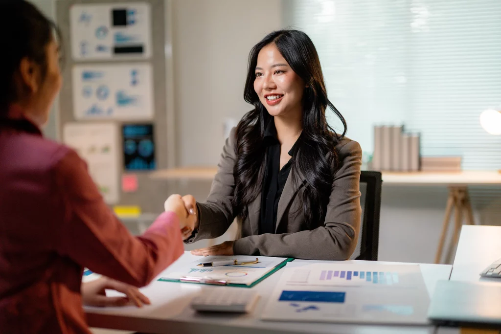 businesswomen-shaking-hands-after-reaching-an-agreement
