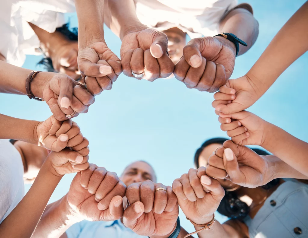 circle-hands-and-fist-bump-by-people-in-support